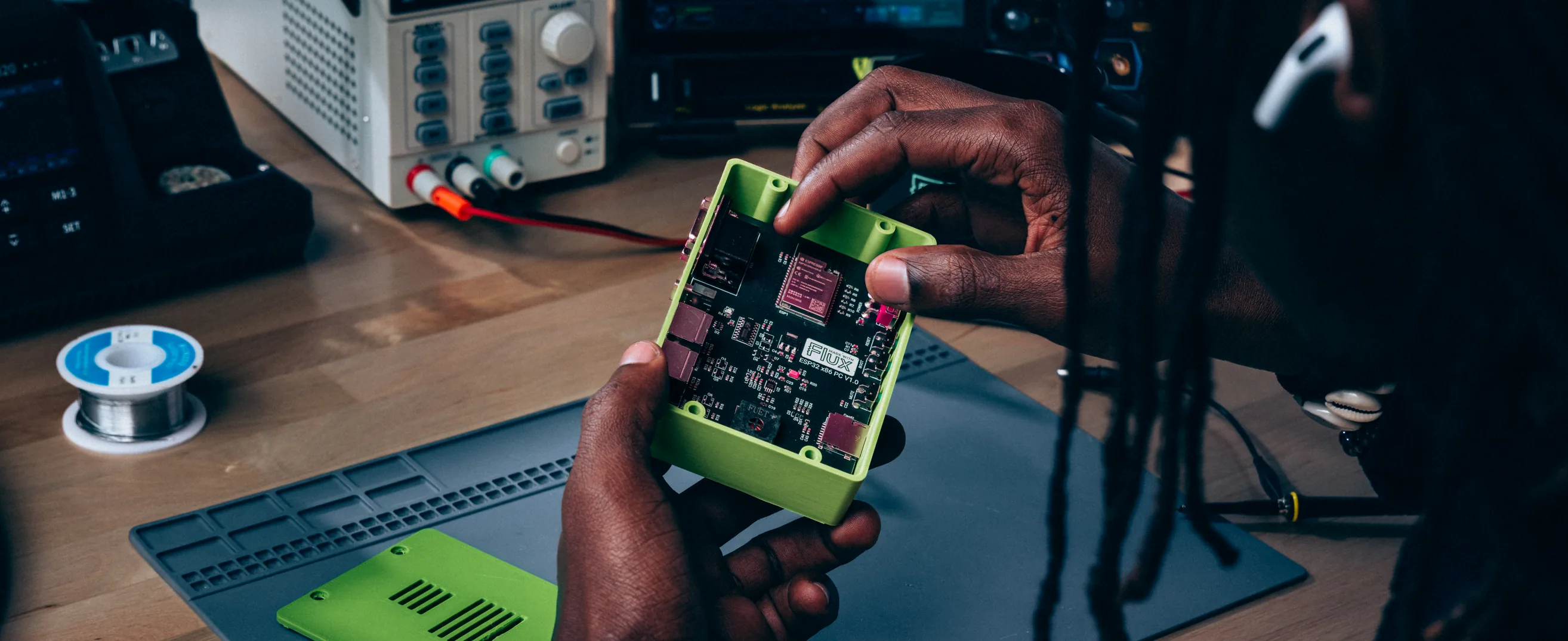 Engineer holding a finished PCB designed with Flux